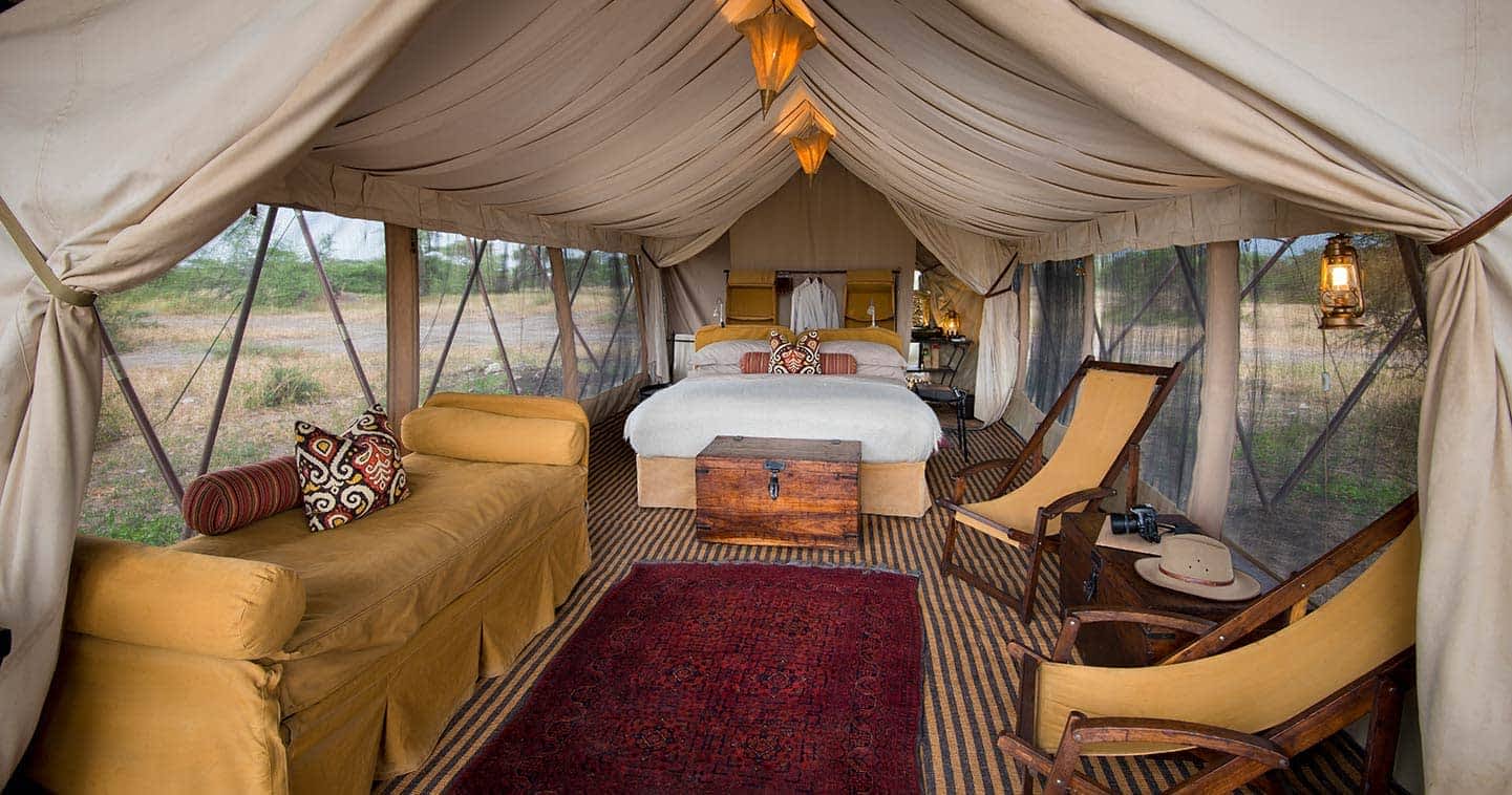 Luxury tented camp in Serengeti at sunset